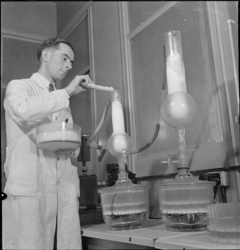 The Story Of Penicillin Past Medical History   Technician Preparing Penicillin In 1943 768x799 